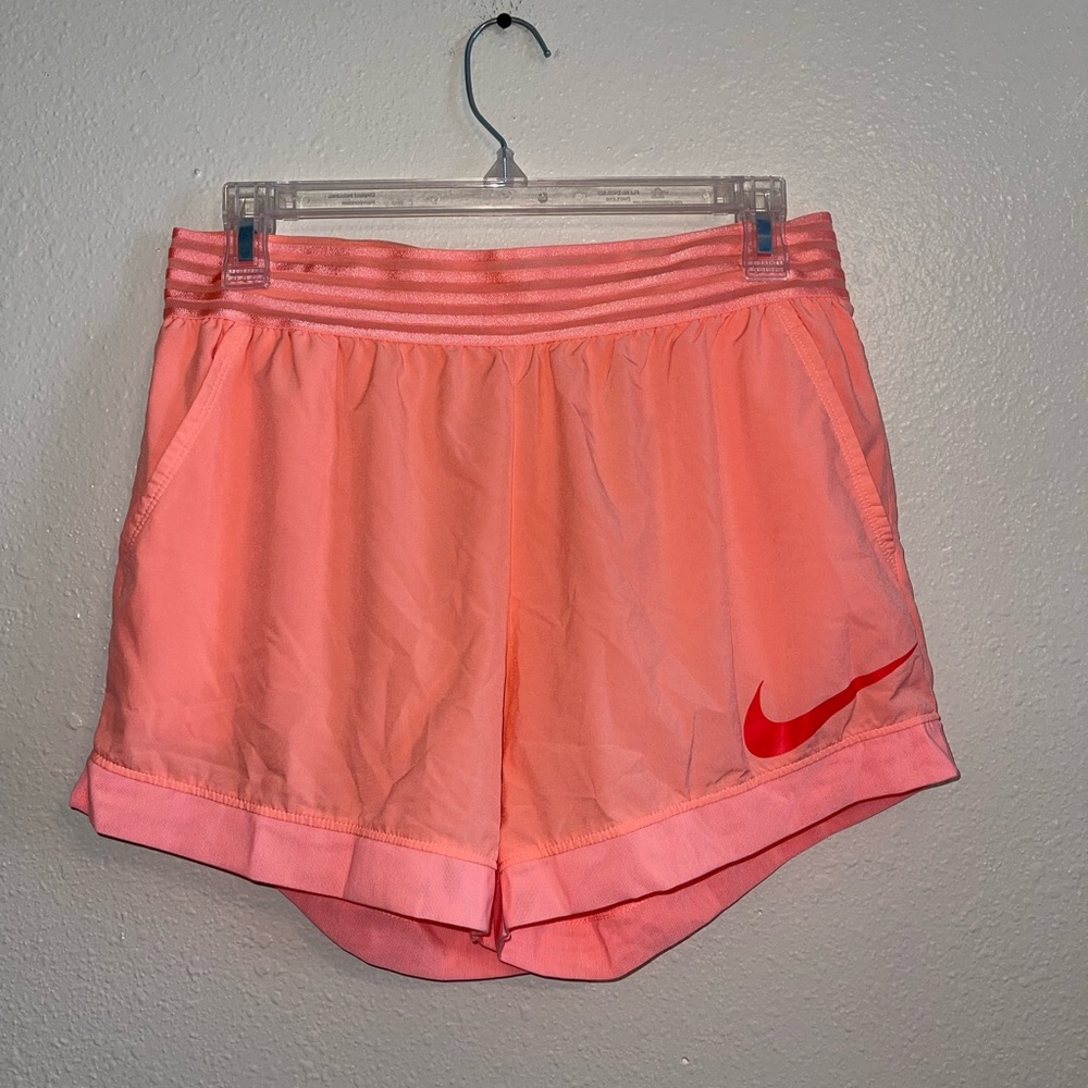 Nike coral/salmon light weight dri fit shorts with pockets